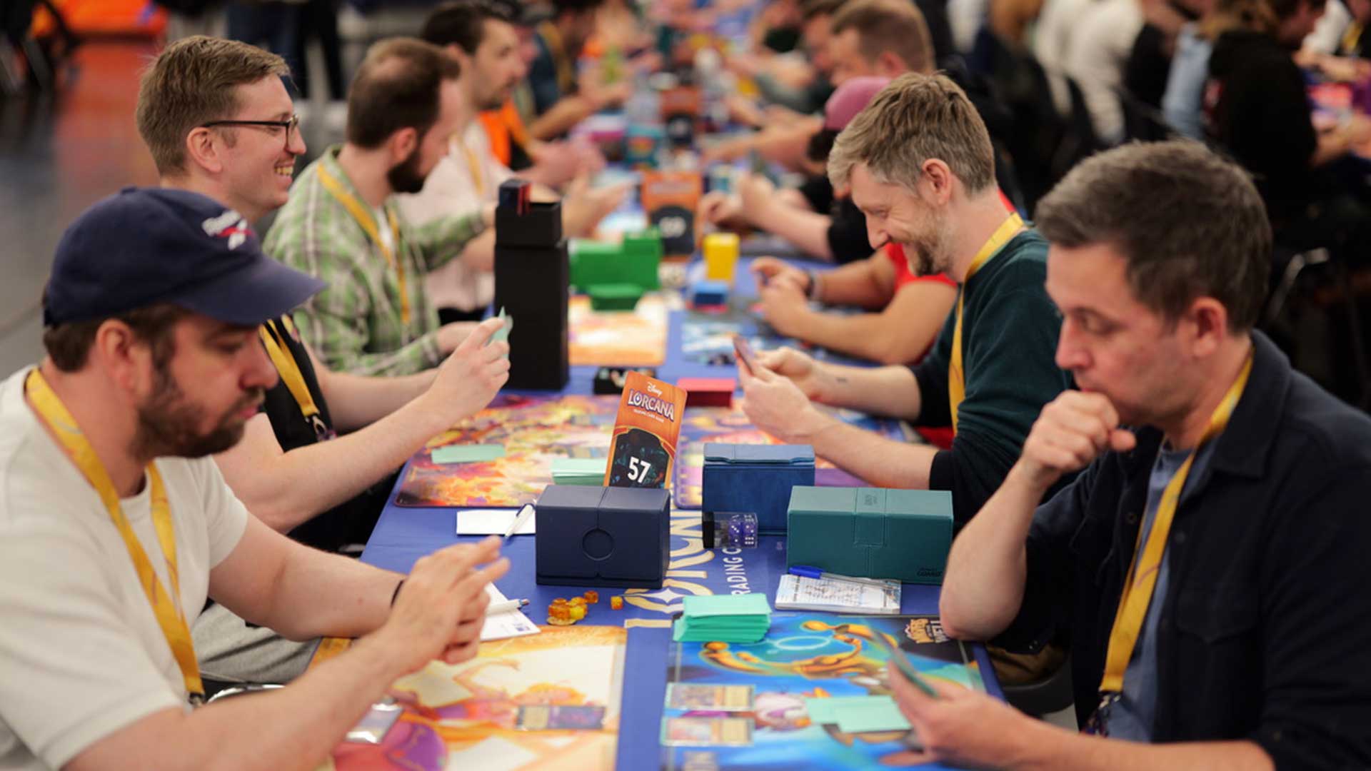 Photo of Disney Lorcana players at a long table