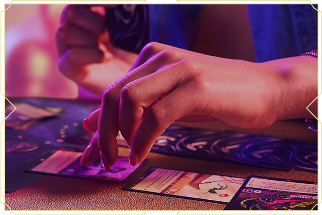 Hand playing Disney Lorcana card