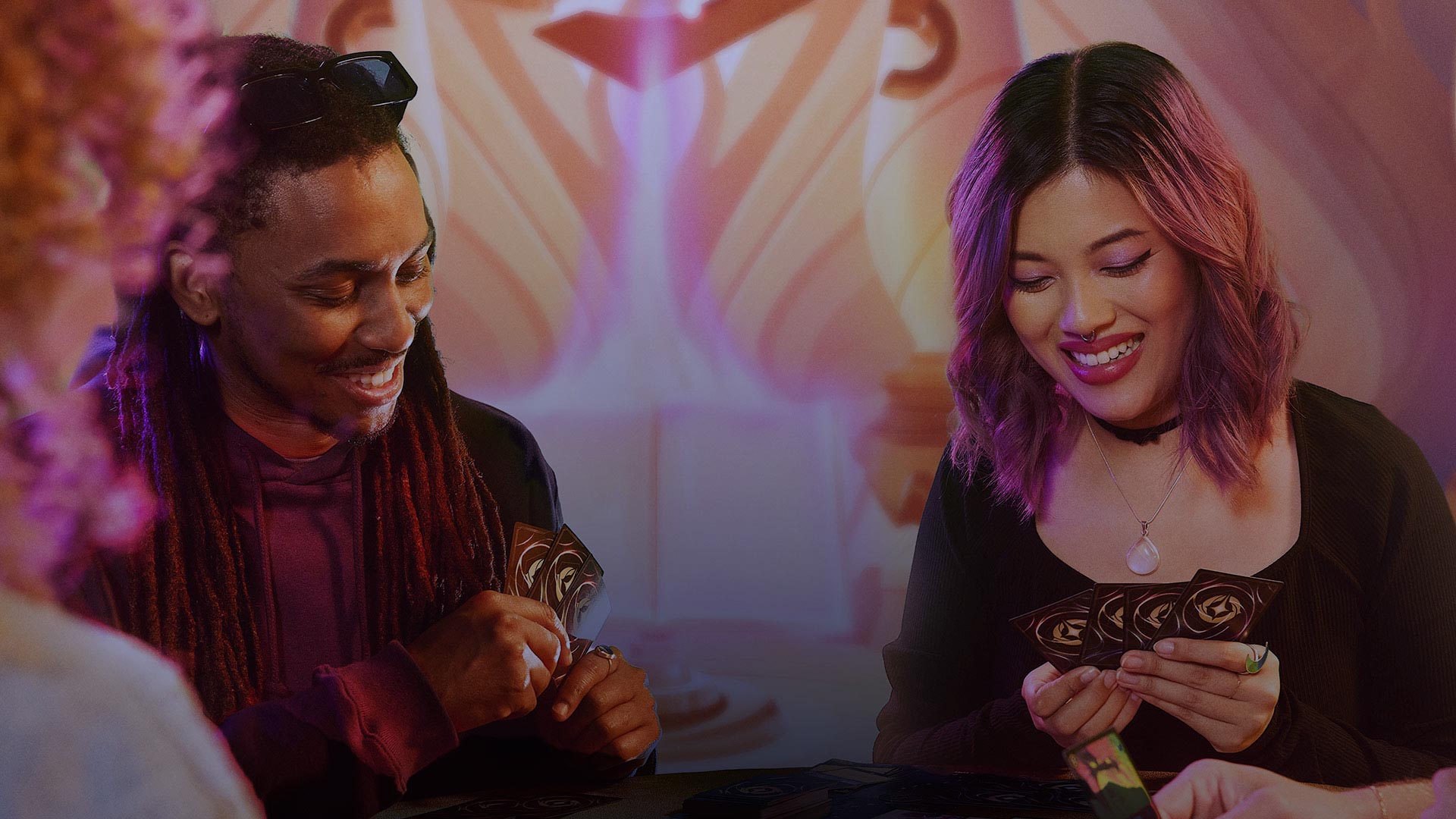 Two people playing Disney Lorcana