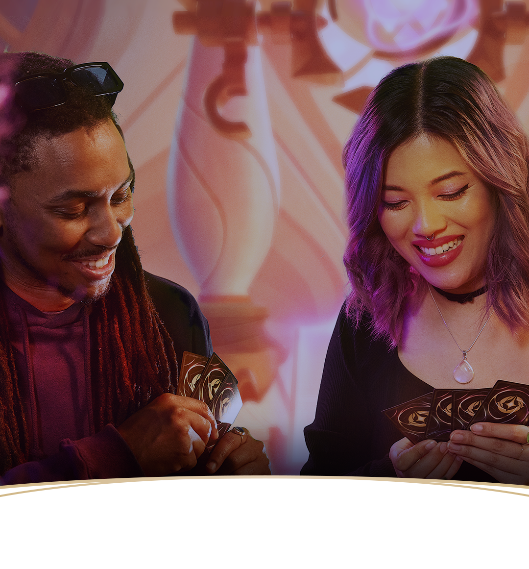Two people playing Disney Lorcana