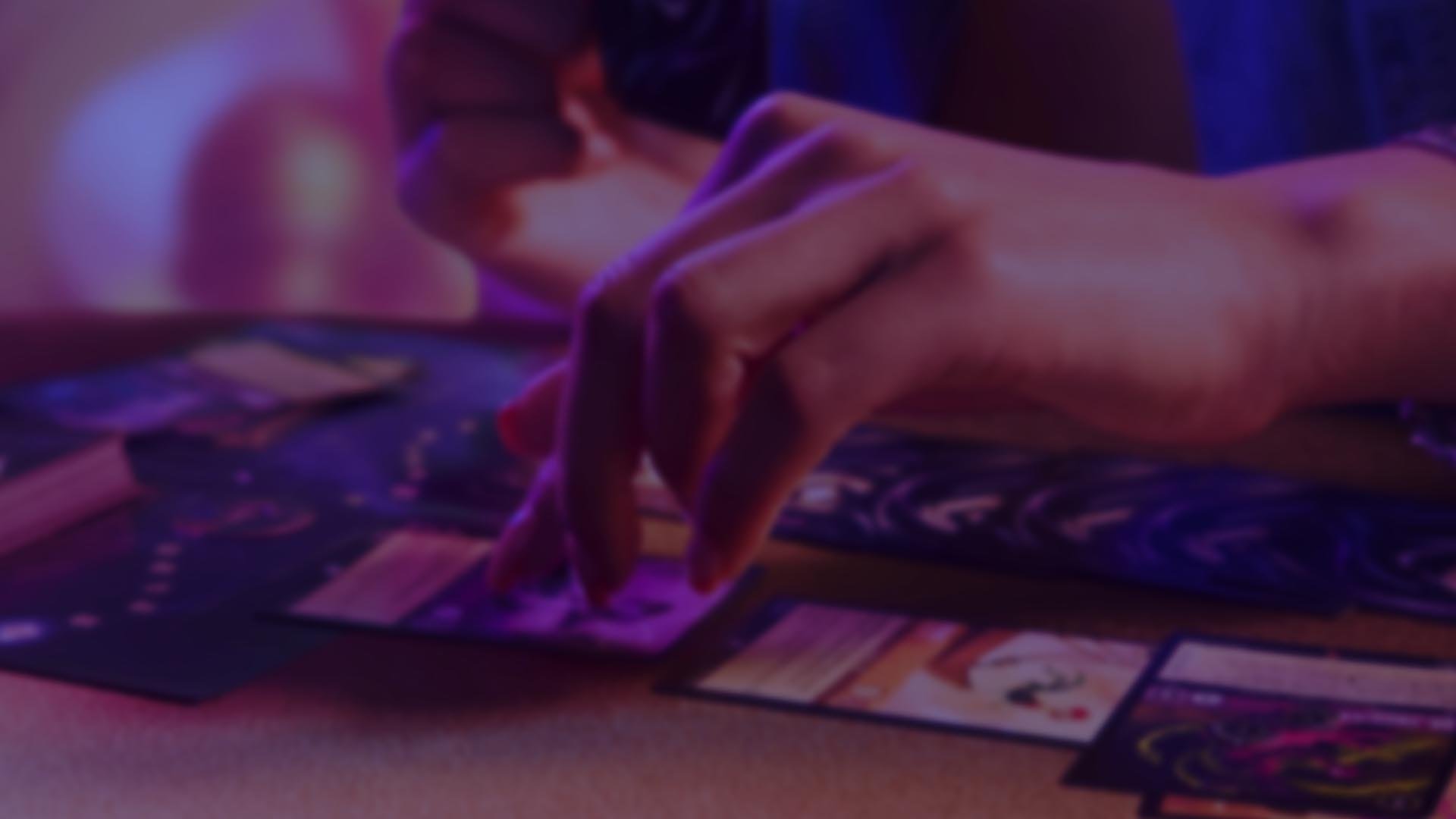 Hand playing Disney Lorcana card